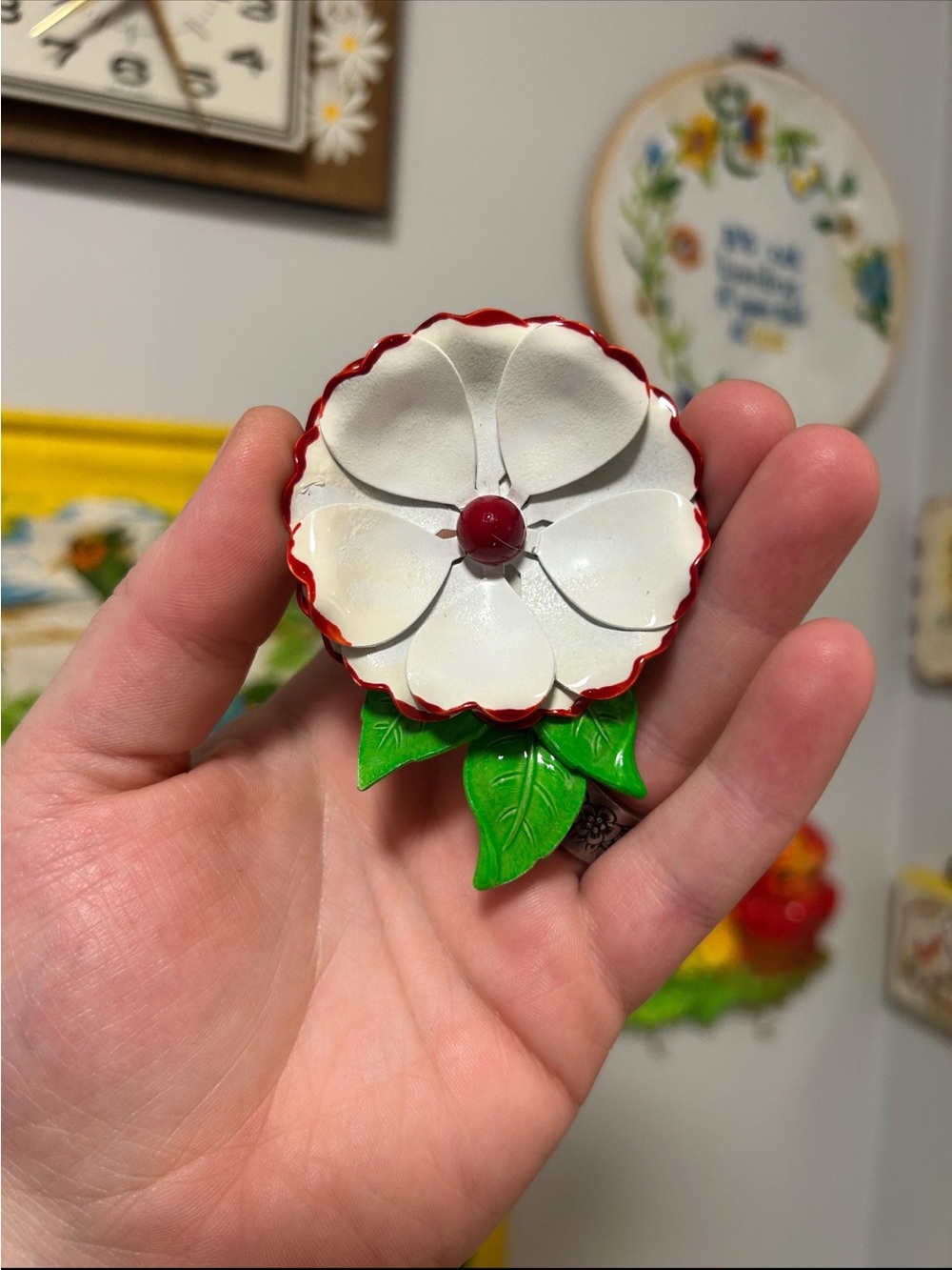 Vintage White Enamel Flower Brooch with Red Trim and Green Leaves
